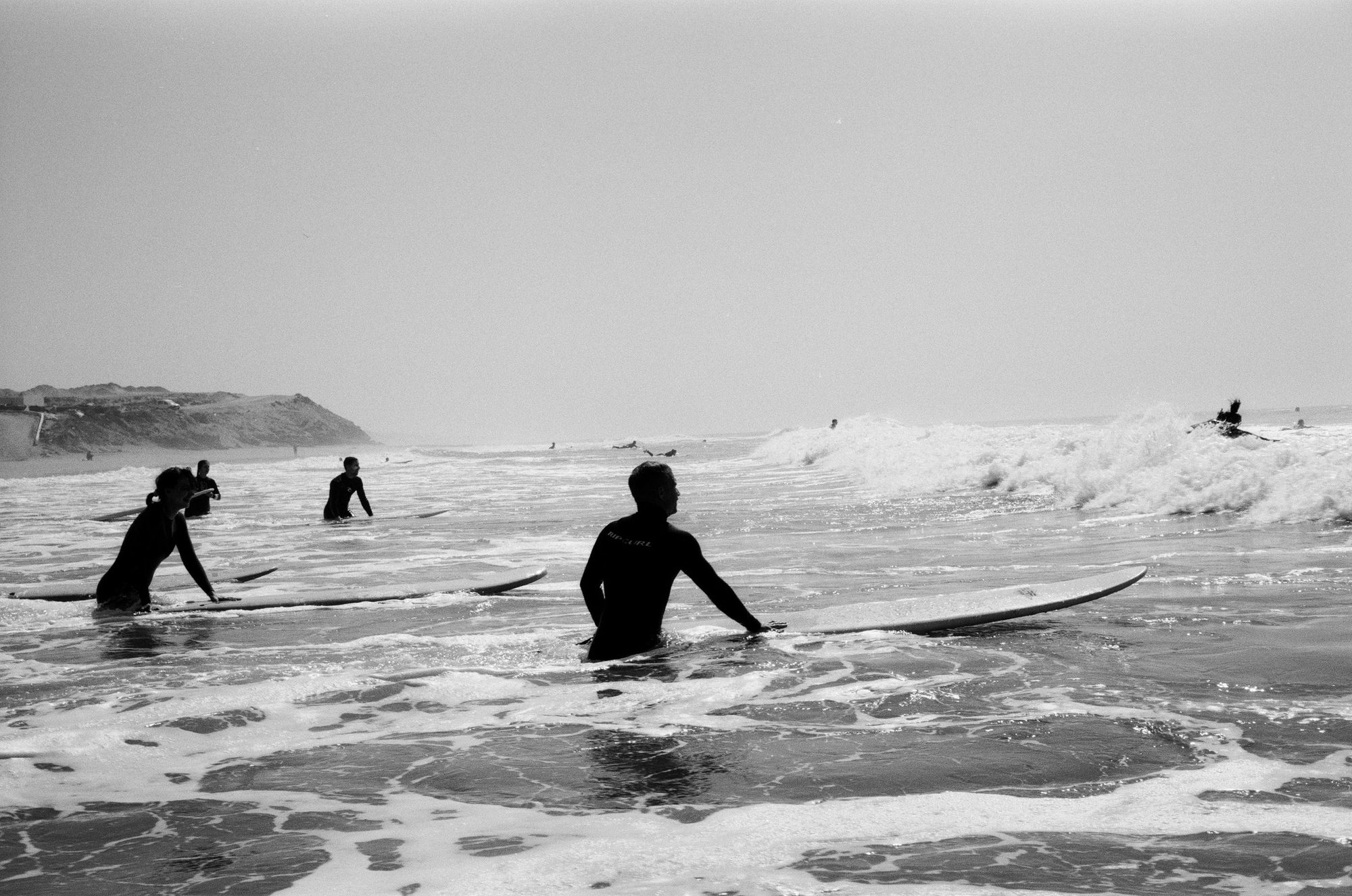 Surfers waiting in the shorebreak at Tamraght, Taghazout Bay