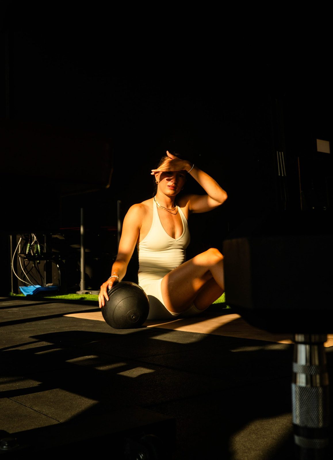 Resting with a medicine ball between rounds