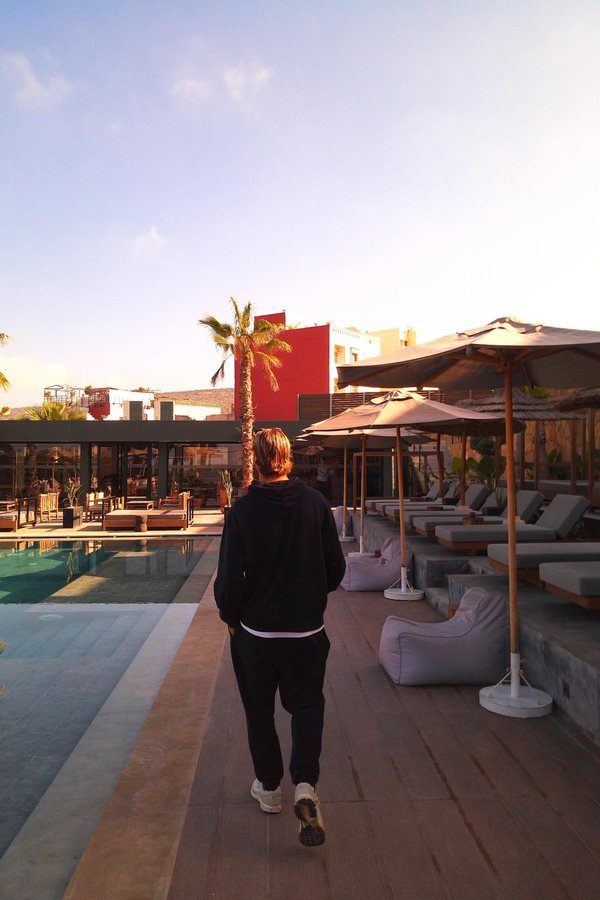 Walking along the pool deck at dusk