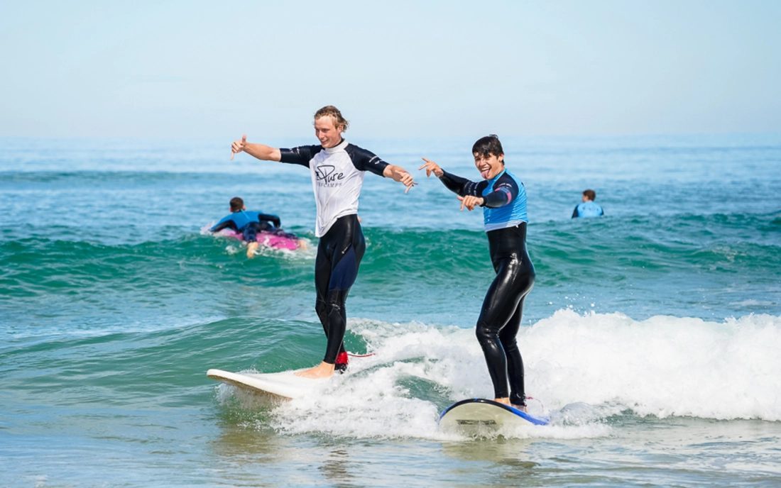 A beginner surf lesson in the whitewater at Tamraght, Taghazout Bay