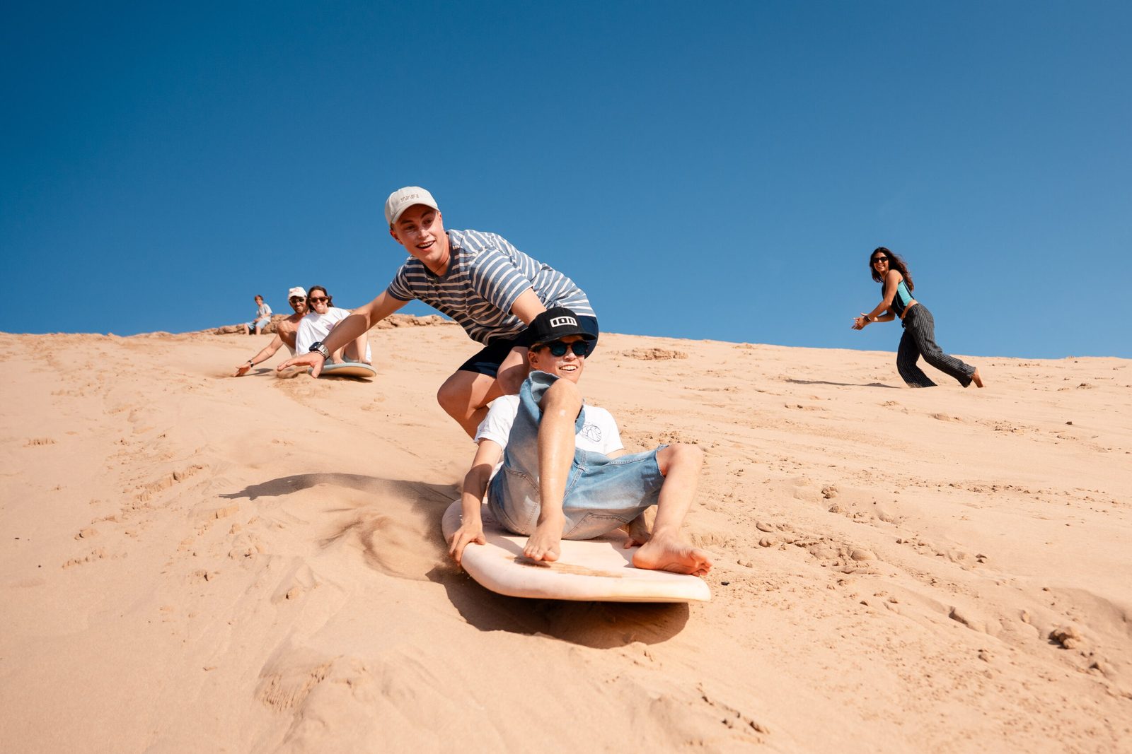 Sandboarding on the dunes at Tamri